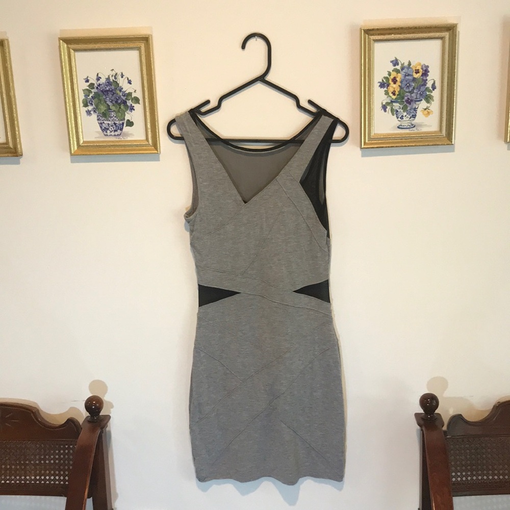 Grey body form dress with mesh cut outs